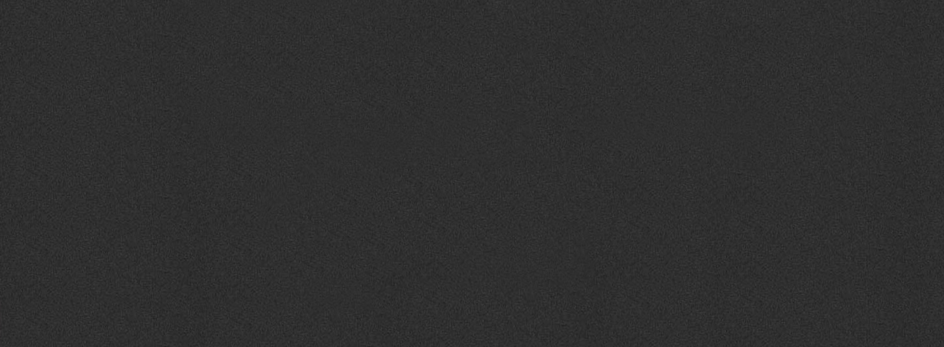 The image is a grayscale gradient transitioning from dark to light, with the lighter end towards the right.
