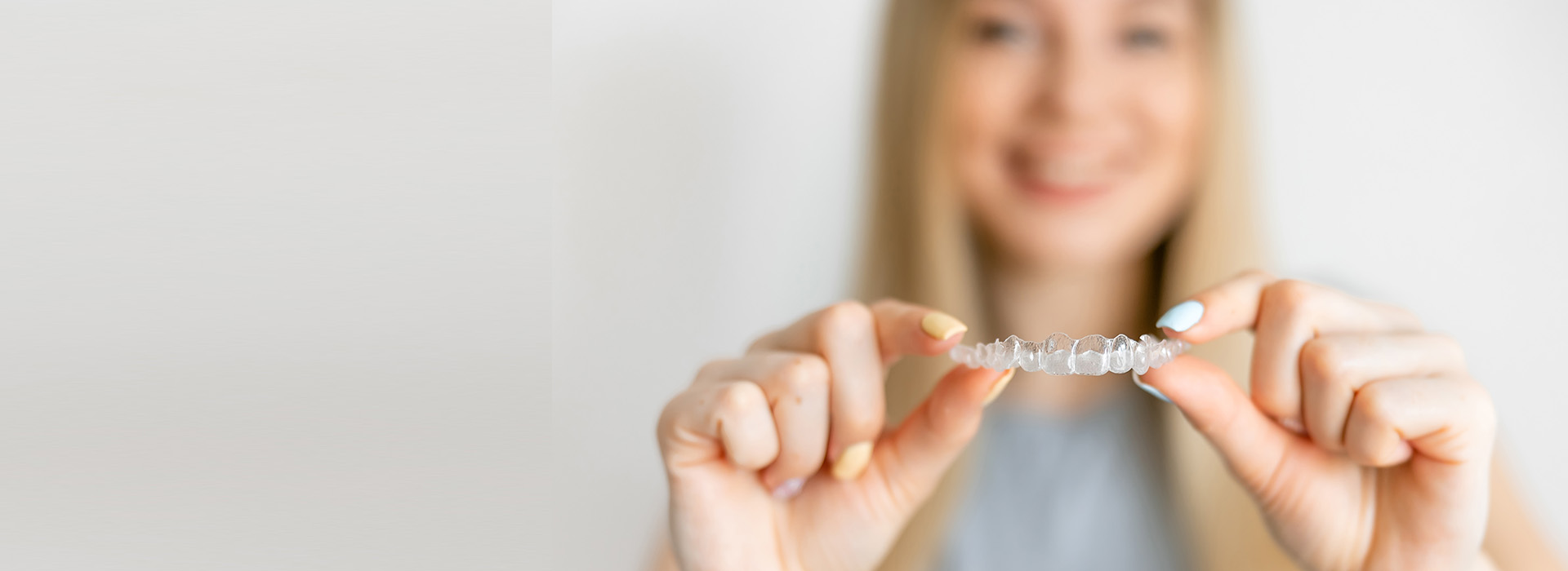 A person holding a ring, with the focus on the jewelry.