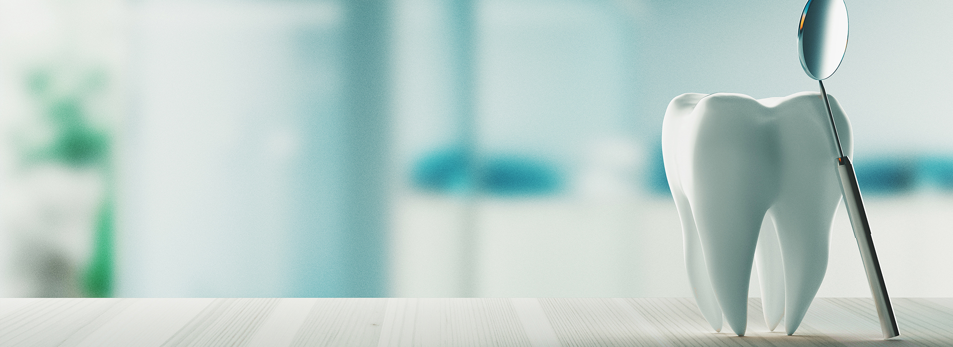 A close-up of a toothbrush with bristles and handle, set against a blurred background featuring an abstract design.