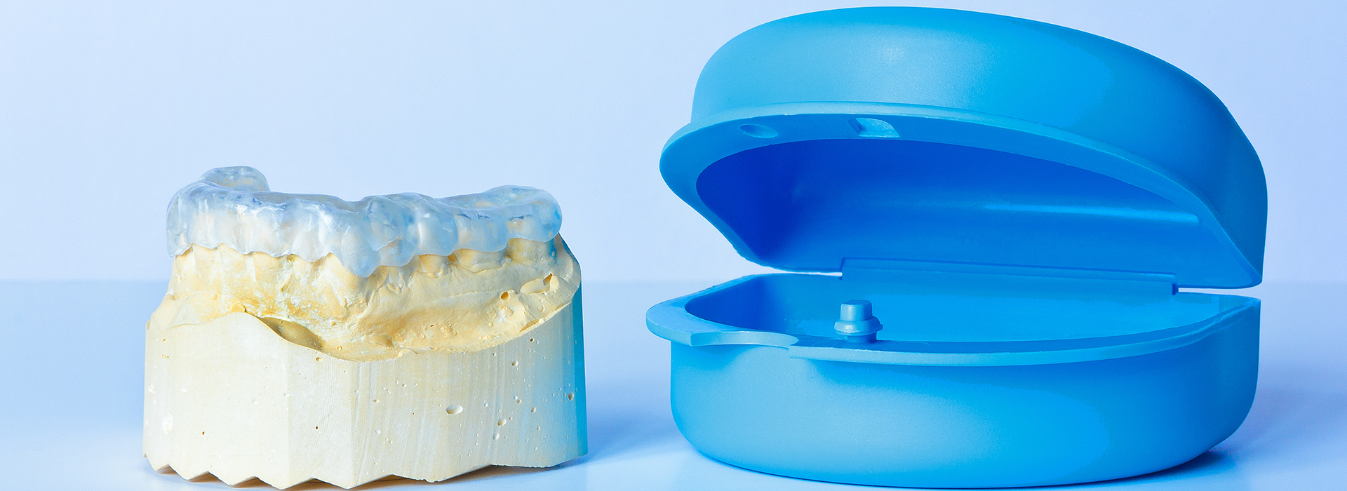 An image featuring a collection of dental implants, including a full set and individual pieces, against a white background.